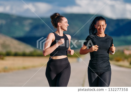 Two Friends Running Together on a Sunny Day, Preparing for Life's Extreme Challenges Two Friends Running Together on a Sunny Day, Preparing for Life's Extreme Challenges 132277358