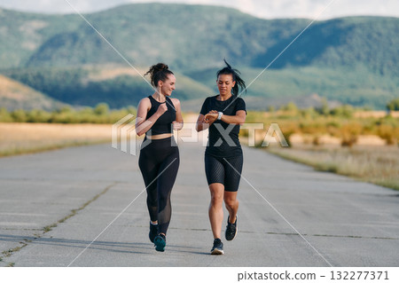 Two Friends Running Together on a Sunny Day, Preparing for Life's Extreme Challenges Two Friends Running Together on a Sunny Day, Preparing for Life's Extreme Challenges 132277371
