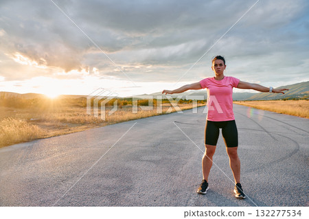 Athlete Stretching at Sunset After Intense Run Athlete Stretching at Sunset After Intense Run 132277534