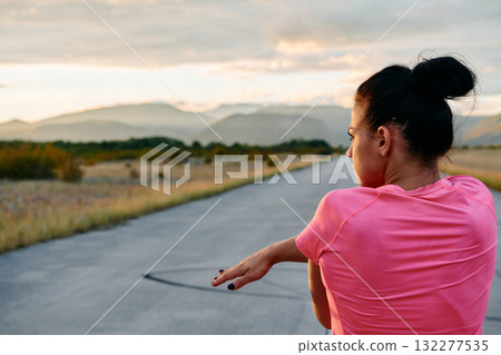 Athlete Stretching at Sunset After Intense Run 132277535