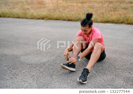 Athletic Woman Preparing for Morning Run 132277544