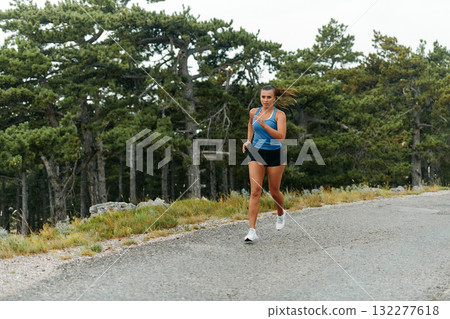 Unstoppable: A Determined Athlete Trains Through the Rain in Pursuit of Marathon Glory Unstoppable: A Determined Athlete Trains Through the Rain in Pursuit of Marathon Glory 132277618