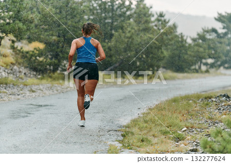 Unstoppable: A Determined Athlete Trains Through the Rain in Pursuit of Marathon Glory Unstoppable: A Determined Athlete Trains Through the Rain in Pursuit of Marathon Glory 132277624