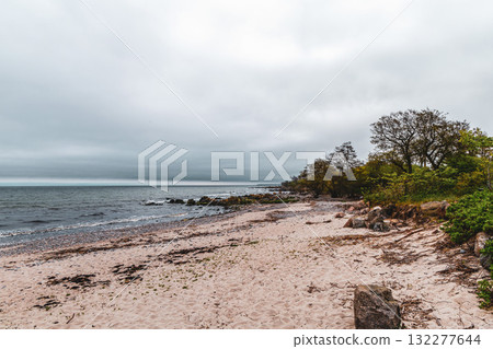 Sea sandy beach in cloudy weather. Seascape Sea sandy beach in cloudy weather. Seascape 132277644
