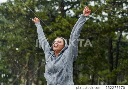 Beautiful Woman Enjoying Rainy Day After Intense Run 132277670