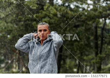 Beautiful Woman Enjoying Rainy Day After Intense Run 132277671