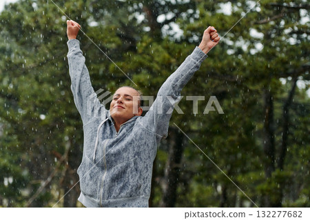 Beautiful Woman Enjoying Rainy Day After Intense Run 132277682