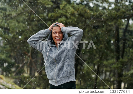 Beautiful Woman Enjoying Rainy Day After Intense Run 132277684