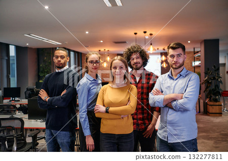 Portrait of successful creative business team looking at camera and smiling. Diverse business people standing together at startup. Selective focus  132277811
