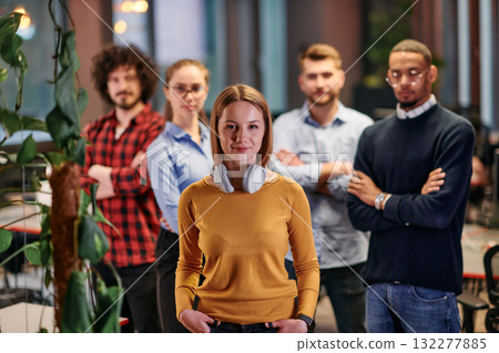 Portrait of successful creative business team looking at camera and smiling. Diverse business people standing together at startup. Selective focus Portrait of successful creative business team looking at camera and smiling. Diverse business people standing together at startup. Selective focus 132277885