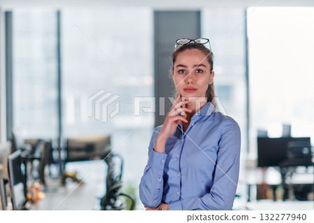 Empowered Elegance: A Confident Businesswoman Radiates Success in Front of Her Office. 132277940