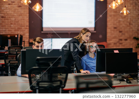 Strategic Business Meeting: Group of Professionals Collaborating in Office Using Computers 132277960