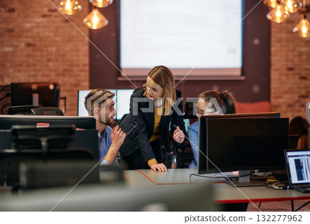 Strategic Business Meeting: Group of Professionals Collaborating in Office Using Computers Strategic Business Meeting: Group of Professionals Collaborating in Office Using Computers 132277962