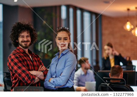 Corporate Collaboration: European Blonde Businesswoman and Colleague Standing in Modern Office 132277966