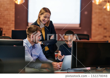 Strategic Business Meeting: Group of Professionals Collaborating in Office Using Computers Strategic Business Meeting: Group of Professionals Collaborating in Office Using Computers 132278048