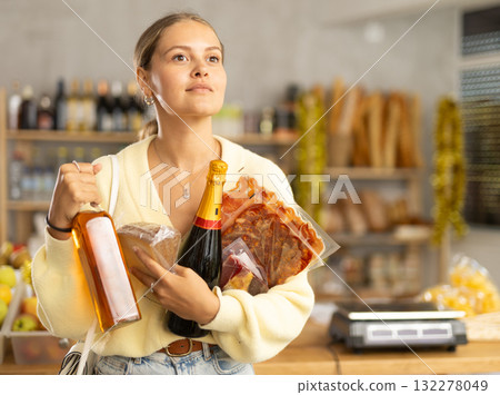 Young woman with food and champagne Young woman with food and champagne 132278049