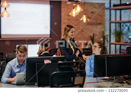 Strategic Business Meeting: Group of Professionals Collaborating in Office Using Computers 132278095