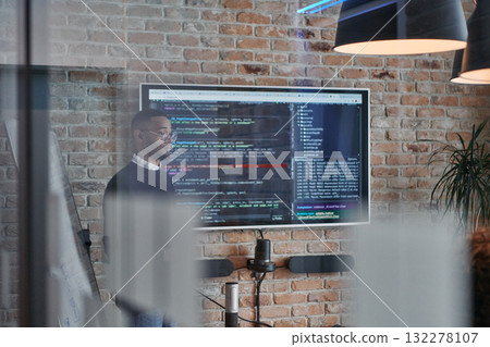 African-American businessman leads a meeting, passionately presenting a business plan to his attentive team, fostering collaboration and strategic thinking African-American businessman leads a meeting, passionately presenting a business plan to his attentive team, fostering collaboration and strategic thinking 132278107