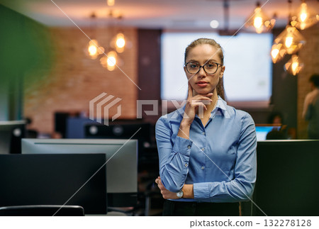 Empowered Elegance: A Confident Businesswoman Radiates Success in Front of Her Office. 132278128