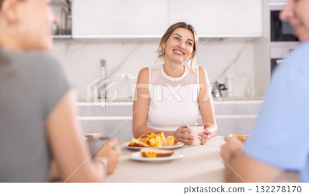 Young girl and guy have nice conversation with woman 132278170