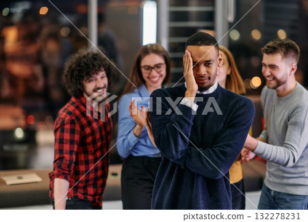 A group of young business people have fun playing interesting games while taking a break from work in a modern office. Selective focus A group of young business people have fun playing interesting games while taking a break from work in a modern office. Selective focus 132278231