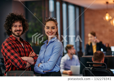 Corporate Collaboration: European Blonde Businesswoman and Colleague Standing in Modern Office 132278341