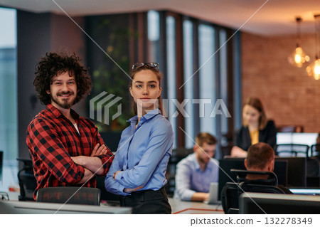 Corporate Collaboration: European Blonde Businesswoman and Colleague Standing in Modern Office 132278349
