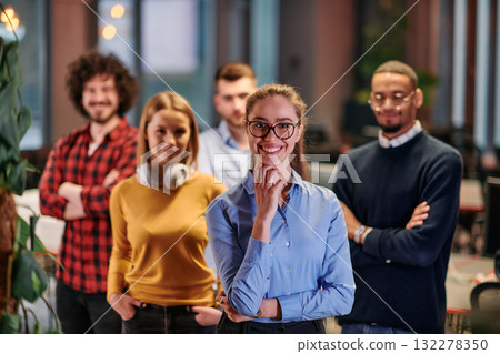 Portrait of successful creative business team looking at camera and smiling. Diverse business people standing together at startup. Selective focus  132278350