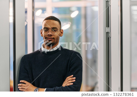 African-American Businessman Posing with Crossed Arms in Modern Office African-American Businessman Posing with Crossed Arms in Modern Office 132278361