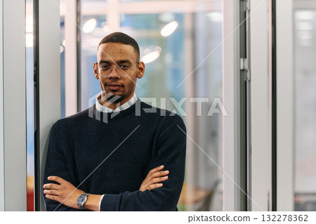 African-American Businessman Posing with Crossed Arms in Modern Office African-American Businessman Posing with Crossed Arms in Modern Office 132278362