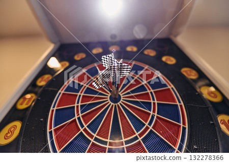 Dart board has dart arrow hitting of a shooting target for business targeting and good success Dart board has dart arrow hitting of a shooting target for business targeting and good success 132278366