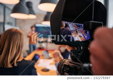 Capturing Corporate Dynamics: Videographer Films Business Meeting in Modern Office. Capturing Corporate Dynamics: Videographer Films Business Meeting in Modern Office. 132278367
