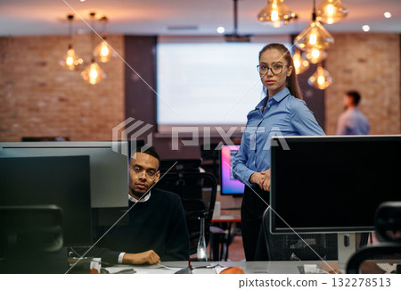 Digital Collaboration: Blonde Businesswoman and African American Partner Reviewing Documents Online Digital Collaboration: Blonde Businesswoman and African American Partner Reviewing Documents Online 132278513