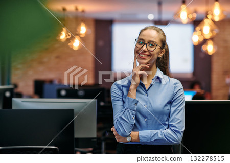 Empowered Elegance: A Confident Businesswoman Radiates Success in Front of Her Office. 132278515