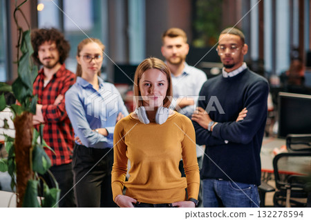 Portrait of successful creative business team looking at camera and smiling. Diverse business people standing together at startup. Selective focus  132278594