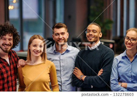 Portrait of successful creative business team looking at camera and smiling. Diverse business people standing together at startup. Selective focus  132278603