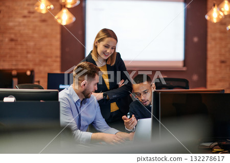Strategic Business Meeting: Group of Professionals Collaborating in Office Using Computers Strategic Business Meeting: Group of Professionals Collaborating in Office Using Computers 132278617