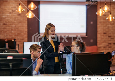 Strategic Business Meeting: Group of Professionals Collaborating in Office Using Computers 132278621