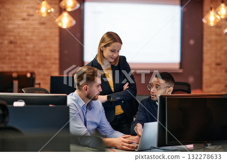 Strategic Business Meeting: Group of Professionals Collaborating in Office Using Computers 132278633