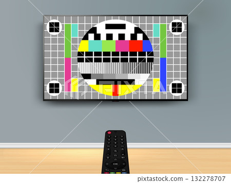 Remote control is pointed at the no signal TV on the wall. 132278707