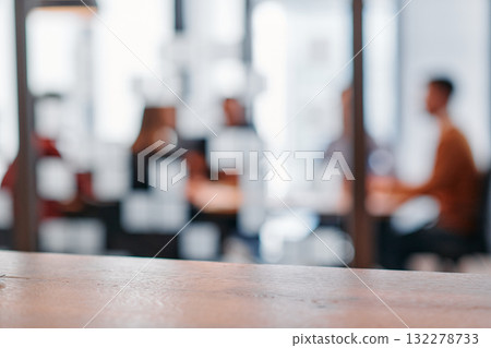 Strategic Conversations: Business Professionals Collaborate in a Modern Office Setting. 132278733