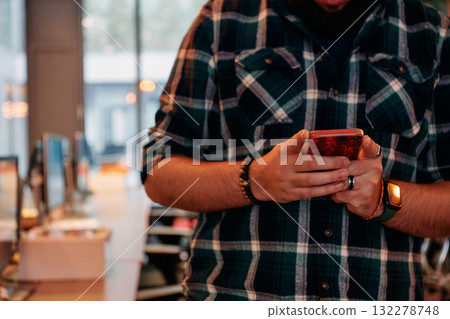 Close Up Young Bearded Programmer Using Smartphone in Office Close Up Young Bearded Programmer Using Smartphone in Office 132278748