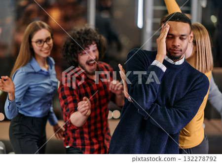 A group of young business people have fun playing interesting games while taking a break from work in a modern office. Selective focus A group of young business people have fun playing interesting games while taking a break from work in a modern office. Selective focus 132278792