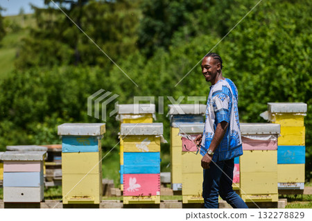 African American Teenager Exploring Small Beekeeping Businesses in Traditional Sudanese Attire amidst Nature 132278829