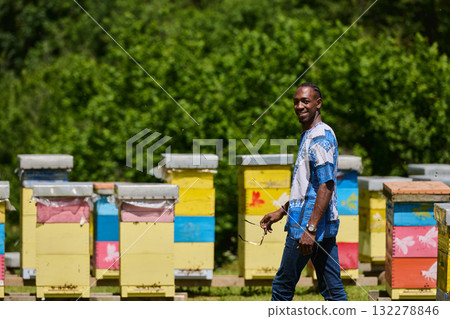African American Teenager Exploring Small Beekeeping Businesses in Traditional Sudanese Attire amidst Nature African American Teenager Exploring Small Beekeeping Businesses in Traditional Sudanese Attire amidst Nature 132278846