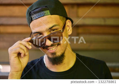 Close Up Portrait of Smiling Sudanese Teenager with Broad Smile, Chin, and Cap Close Up Portrait of Smiling Sudanese Teenager with Broad Smile, Chin, and Cap 132278861