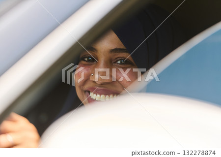 Middle Eastern Teenage Girl Driving Through Scenic Nature 132278874