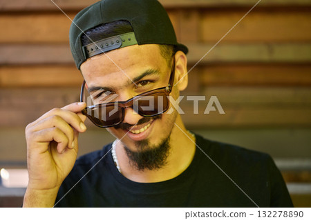 Close Up Portrait of Smiling Sudanese Teenager with Broad Smile, Chin, and Cap Close Up Portrait of Smiling Sudanese Teenager with Broad Smile, Chin, and Cap 132278890