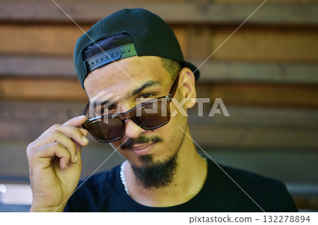 Close Up Portrait of Smiling Sudanese Teenager with Broad Smile, Chin, and Cap Close Up Portrait of Smiling Sudanese Teenager with Broad Smile, Chin, and Cap 132278894
