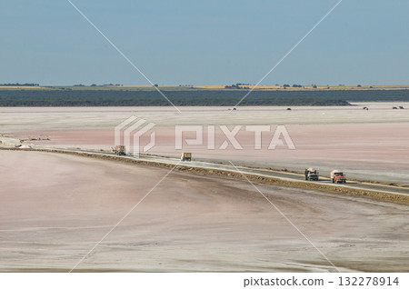 Trucks unloading raw salt bulk, Salinas Grandes de Hidalgo, La Pampa, Argentina. 132278914